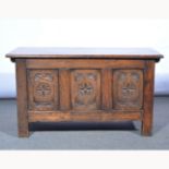 Reproduction joined oak coffer, three panel front fascia with carved decoration, width 91cm.