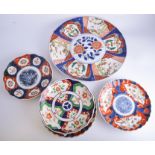 Imari circular charger, compartmentised decoration with flowers and foliage,