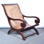 Hardwood armchair, cane panel, width 62cm. CONDITION: Cane is good, no damage.