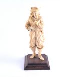 A Dieppe carved ivory figure, a cavalier, 21cm, mounted on a hardwood plinth.