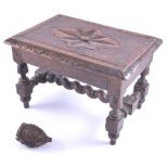 A small oak stool with moulded edge, and stretchers 19cm high,