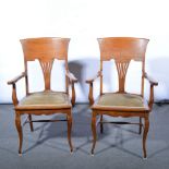 Pair of American oak elbow chairs, pierced vase slats, upholstered seats, cabriole legs,