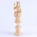 A Dieppe carved ivory figure, a lady wearing a bonnet and holding a letter, cylindrical plinth,