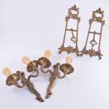 Brass wall mounted sconces, tie backs and easels and a pair of cast Rococo style candelabra.