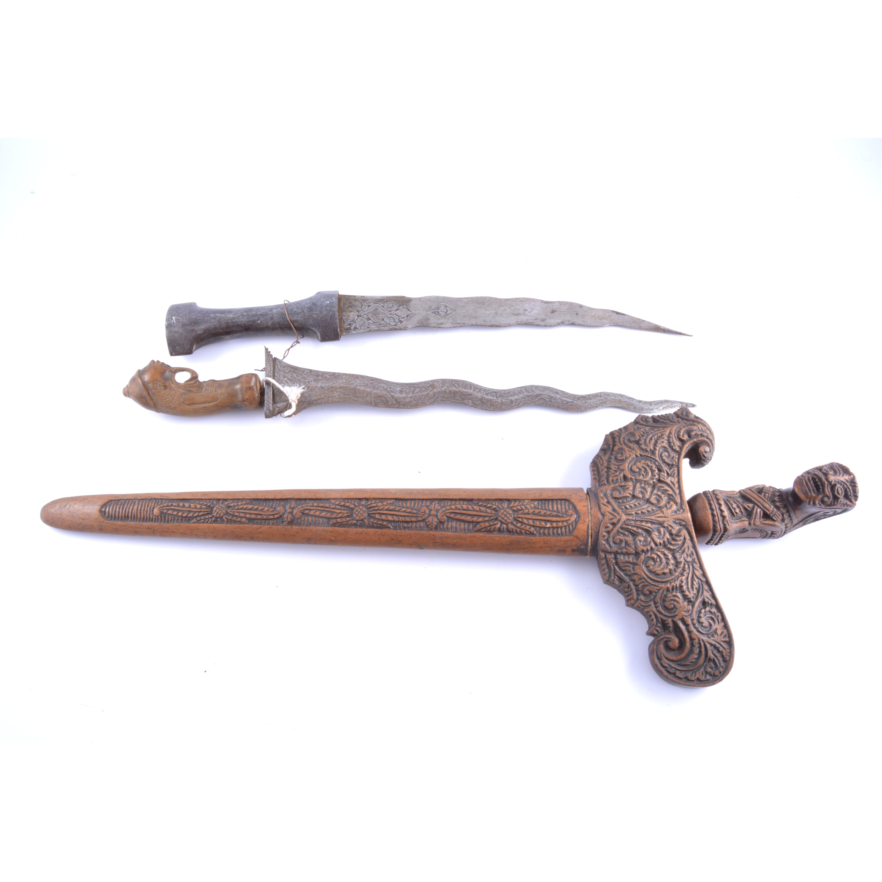 Malay Kris, 37cm watered blade, with separate extended guard, carved figural handle,