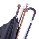 White metal mounted cane, (af); a walking-stick; umbrella; and a swagger stick.
