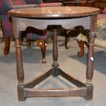 Small oak cricket table, 20th Century, circular top, turned legs joined by stretchers,