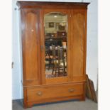 Edwardian walnut wardrobe, moulded cornice, plain frieze, central mirrored panelled door,