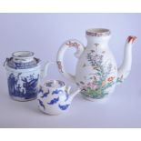 Three blue and white teapots, other teaware and a polychrome coffee pot.