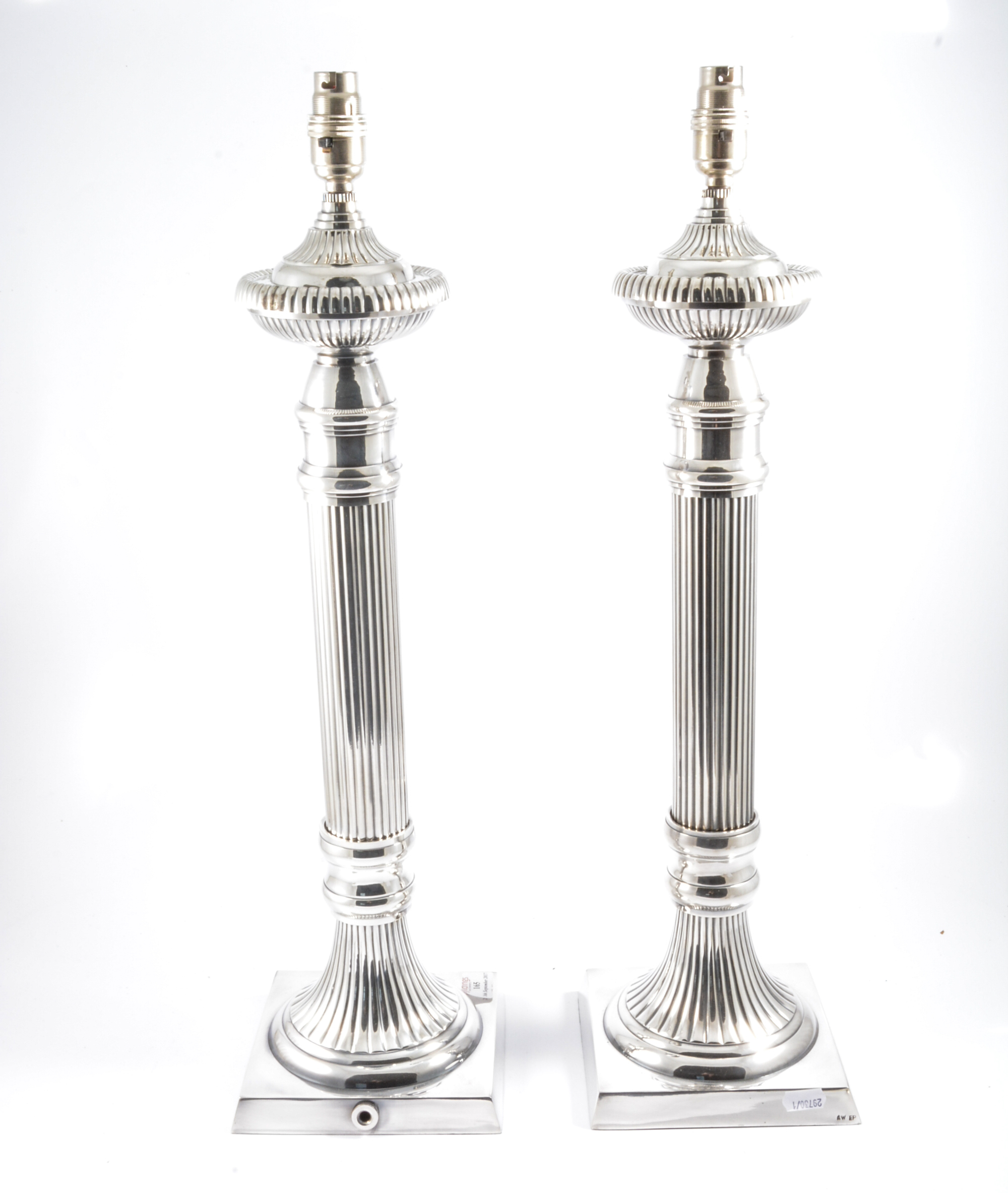 A pair of modern silver-plated column table lamps in the classical style,