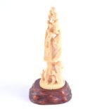 A Japanese ivory okimono, a man holding a scroll accompanied by boys, seal missing, 20cm.