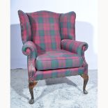 Georgian style wing-back armchair, check pattern upholstery, stained wood cabriole legs,