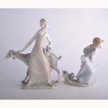 Four Lladro figures, boy with fishing rod, girl with a large goat etc.