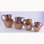 Doulton stoneware tavern jug, applied decoration, 19cm; and four others similar,