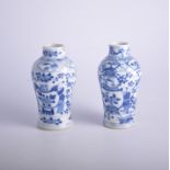 Nao pair of Chinese blue and white baluster shape vases, bearing Kangxi four-character mark,