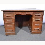 Edwardian oak twin pedestal desk, rectangular top, two columns of drawers, width 123cm, depth 76cm,