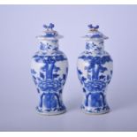 Pair of Chinese blue and white covered vases, baluster form, decorated with birds and foliage,