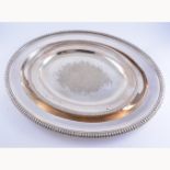 Two silver-plated oval meat platters, with an egg bead border, 57cm and 41cm.