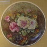 Hand painted porcelain plaque, flowers and berries, apparently unsigned, circular, diameter 23cm,