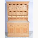 Modern pine dresser, moulded cornice above panelled back with fixed shelves, (3 of 4 drawers),