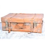 Painted metal trunk, 69cm; a leather suitcase,