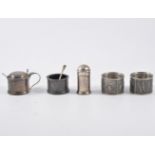 Modern silver five piece condiment (including two spoons),