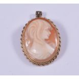 An oval carved shell cameo pendant/brooch, female profile facing left 33mm x 26mm,