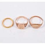 Three gold rings - 22ct wedding band, 9ct gold signet ring and another 9ct signet ring,