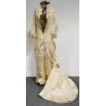 Victorian half bustle wedding dress, cream silk with lace collar and cuffs.