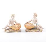 Pair of Meissen figural salts, the seated figures holding nautical shells underglaze mark, 10cm,