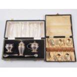 Five piece silver condiment set, Birmingham 1965, baluster shape include a pair of spoons, cased,