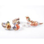 Eight Royal Crown Derby animal paperweights, silver and gold buttons,