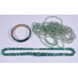 A malachite bead necklace, 56cm long, the beads graduating from 17mm to 6.