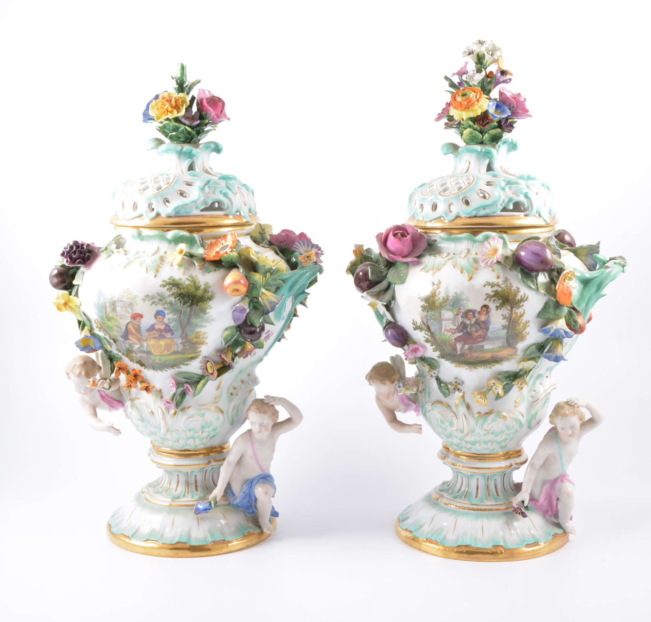 Pair of Meissen style urns, early 20th Century encrusted with flowers, fruit and cherubs,