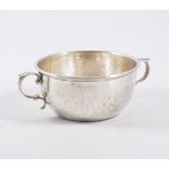 A beaten silver twin handled bowl, by Charles Edwards, London 1916, 16cm 5.5oz.