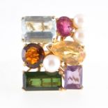 A multi-stone dress ring, a large rectangular cluster 25mm x 20mm,