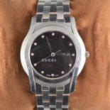 Gucci - A Gentleman's quartz wrist watch, circular black dial with white diamante points,