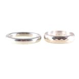 Two white metal wedding bands, a 3.