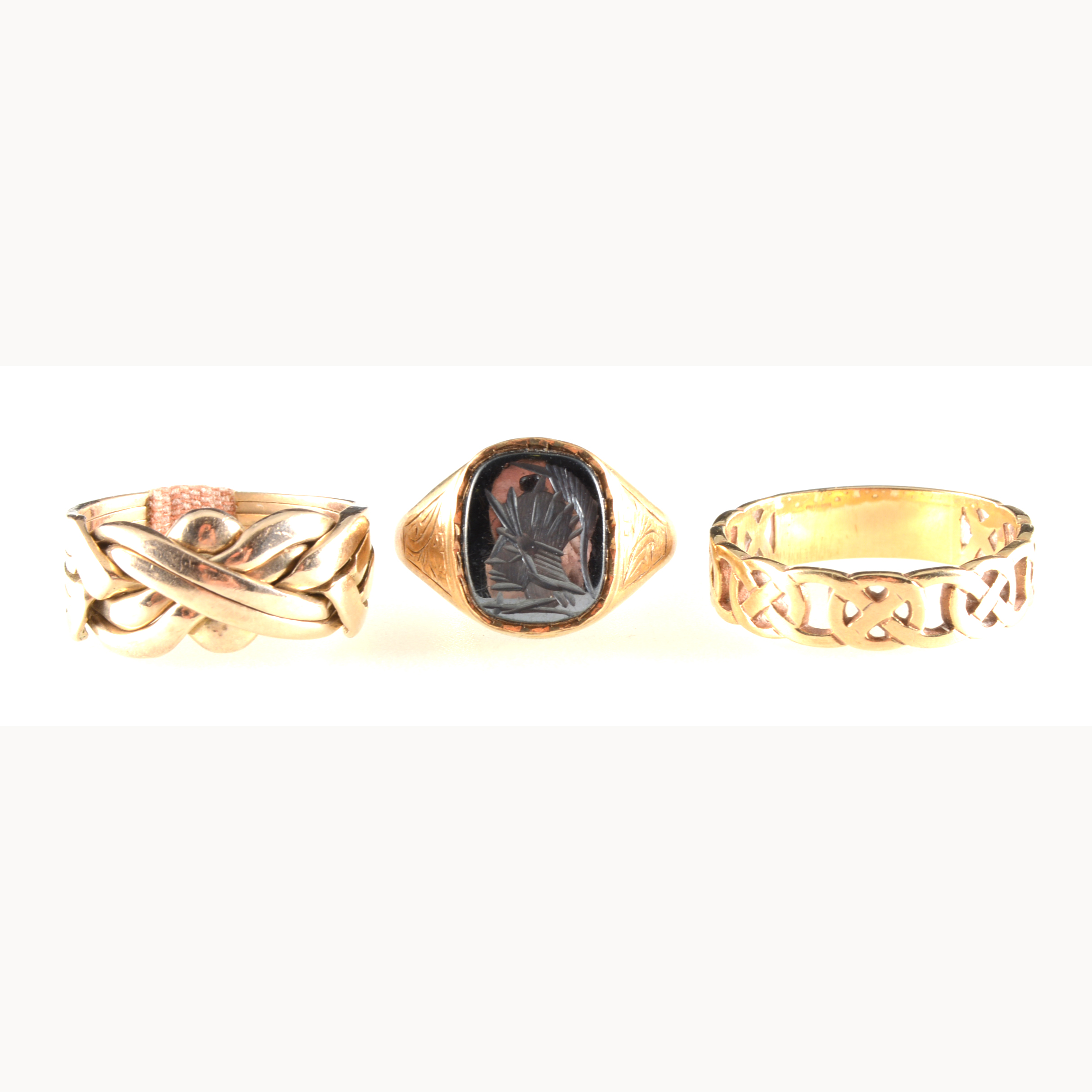 Three gold rings, a 9 carat yellow gold signet ring with intaglio carved haematite warriors head, - Image 2 of 2