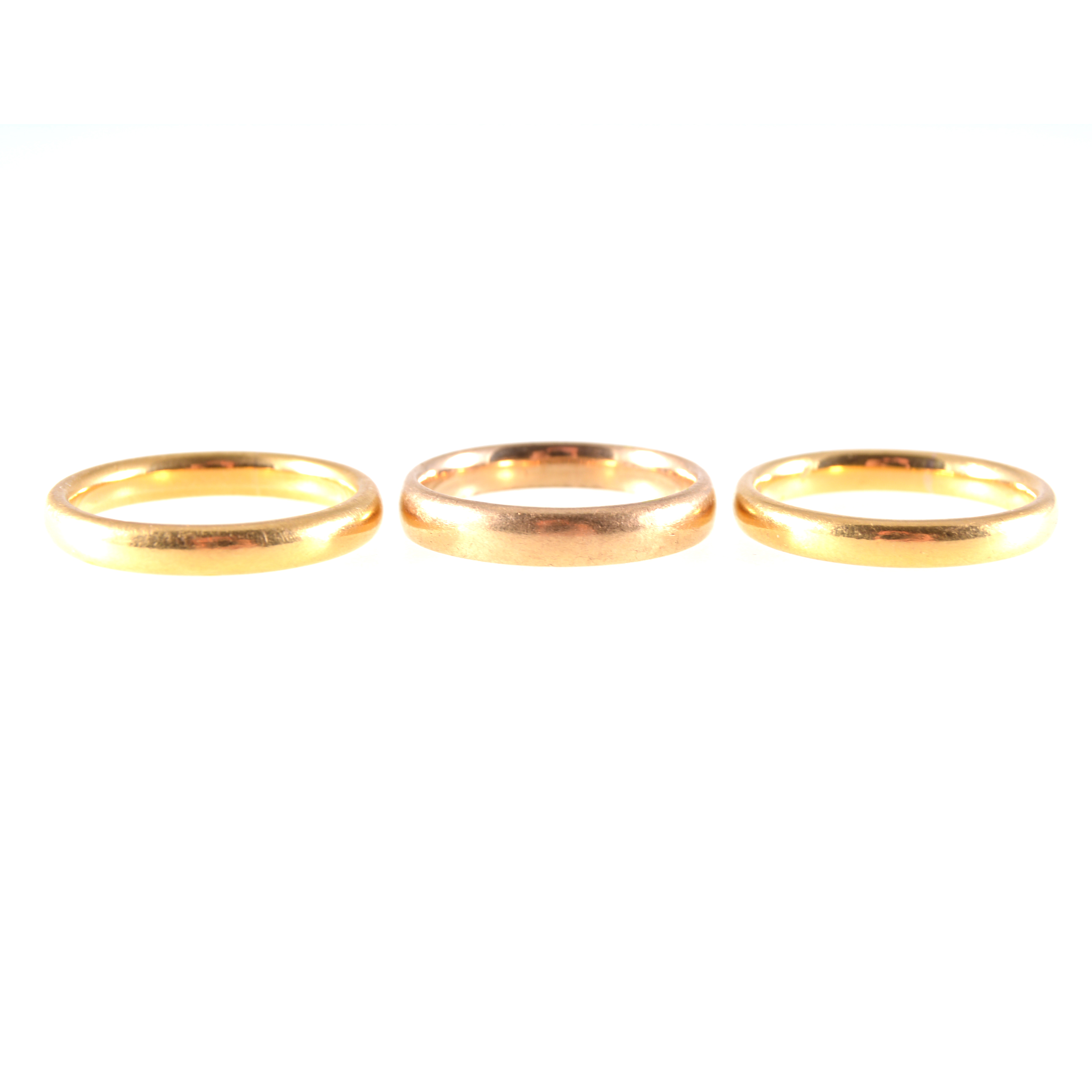 Three 22 carat yellow gold wedding bands, 3m and 3,5mm wide, plain polished finish,