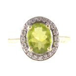 A peridot and diamond oval cluster ring, an oval mixed cut peridot 10mm x 8mm,