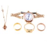 A collection of rings and a watch and pendant,