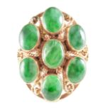 A green stone dress ring,