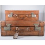 A vintage leather suitcase, 63cm, metal mounts and another smaller, (2).