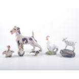 Royal Copenhagen porcelain terrier model 1452, and five other small animal models,