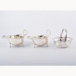 Pair of silver sauce boats, by Adie Bros., Birmingham 1926, cut outlines, flying scroll handles, 8.