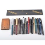 Small collection of vintage fountain pens.