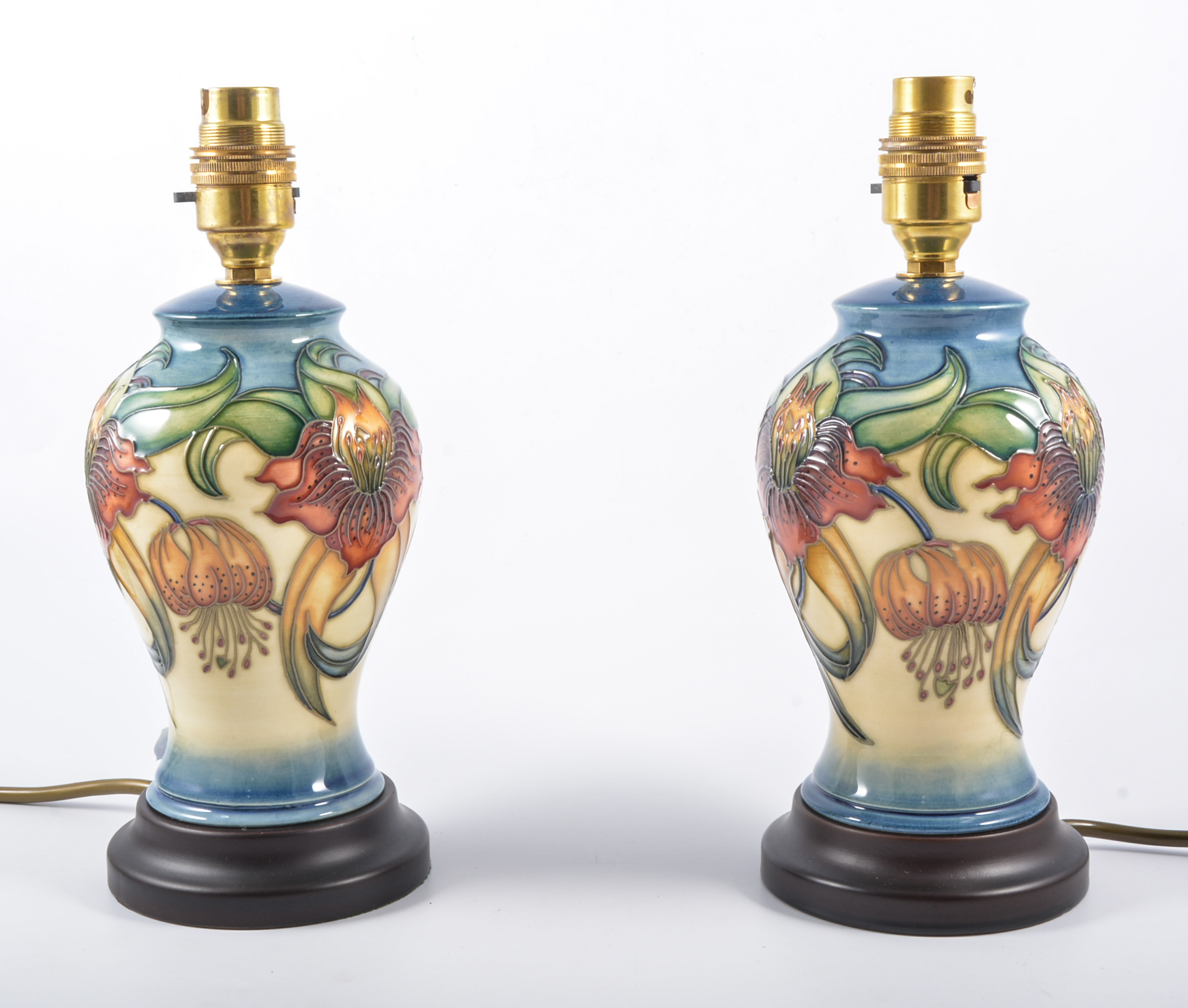 Nicola Slaney for Moorcroft Pottery 'Anna Lily', pair of lamp bases, raised on turned plinths, 24.