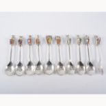 A set of ten silver enamelled teaspoons, The Queens Beasts, by Toye, Kenning & Spencer,