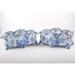 A pair of Dutch Delft blue and white two division bulb pots, probably 19th Century, bombe form,
